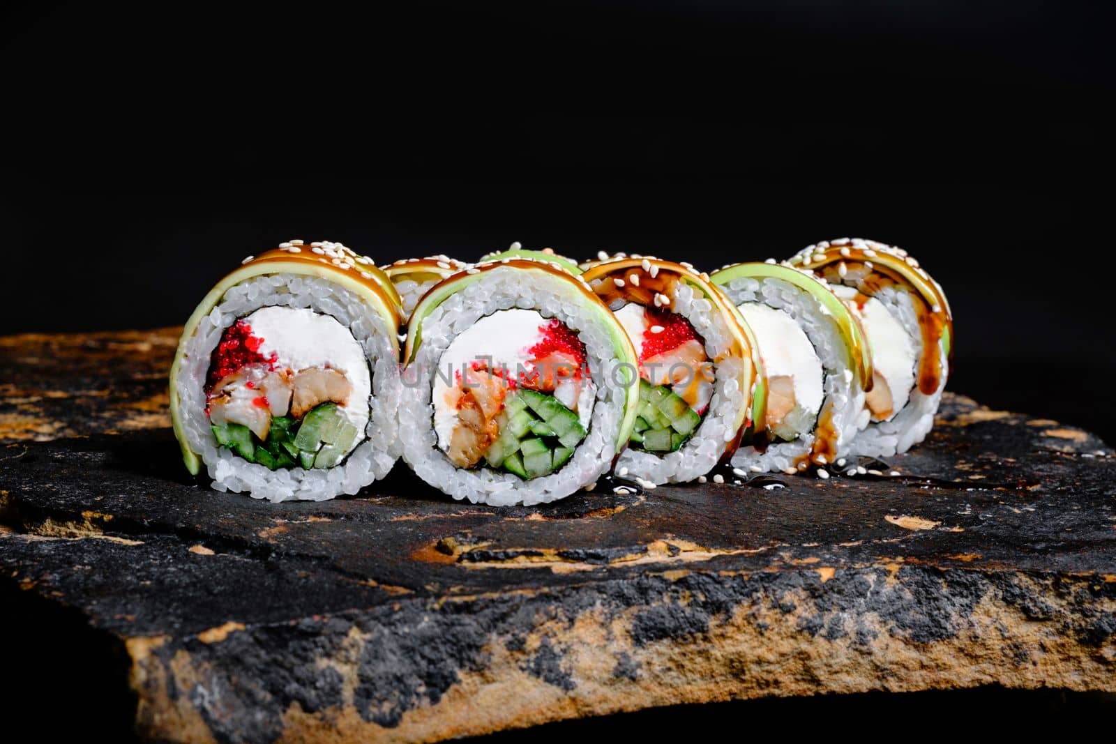 Delicious Sushi Roll on a stone Plate by Symonenko