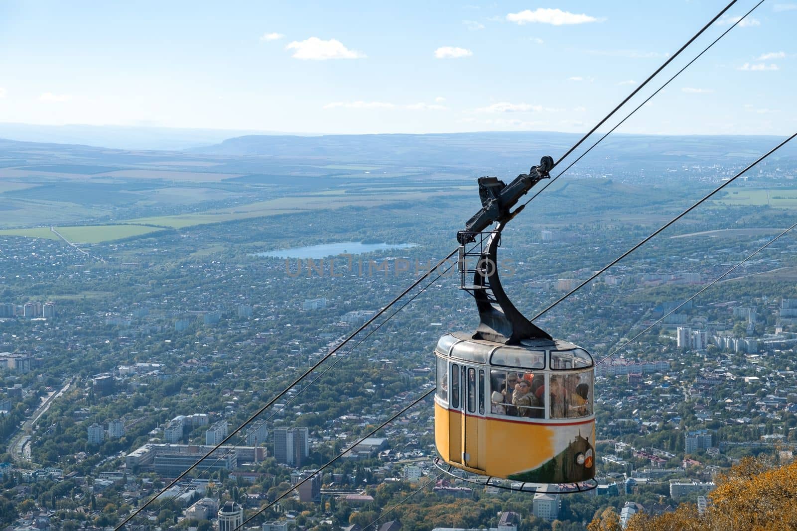 Cable car with tourists on Mount Mashuk. by OlgaGubskaya