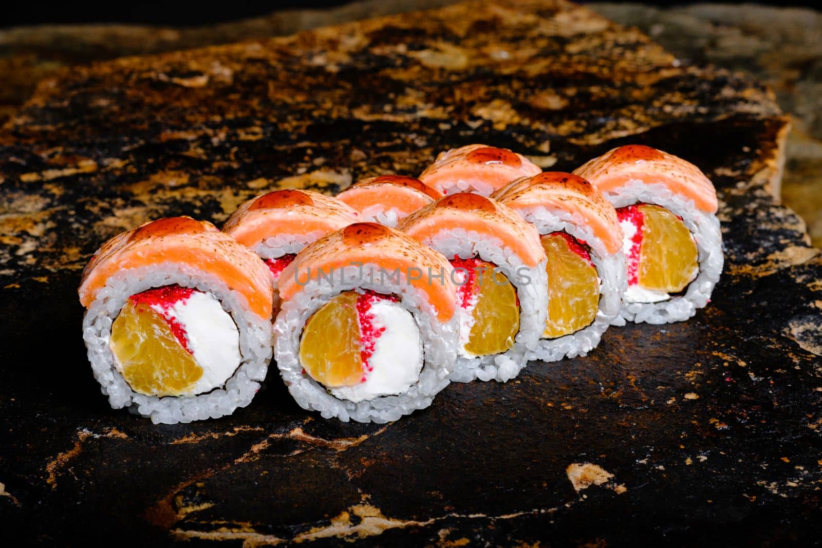 Delicious Sushi Roll on a stone Plate by Symonenko