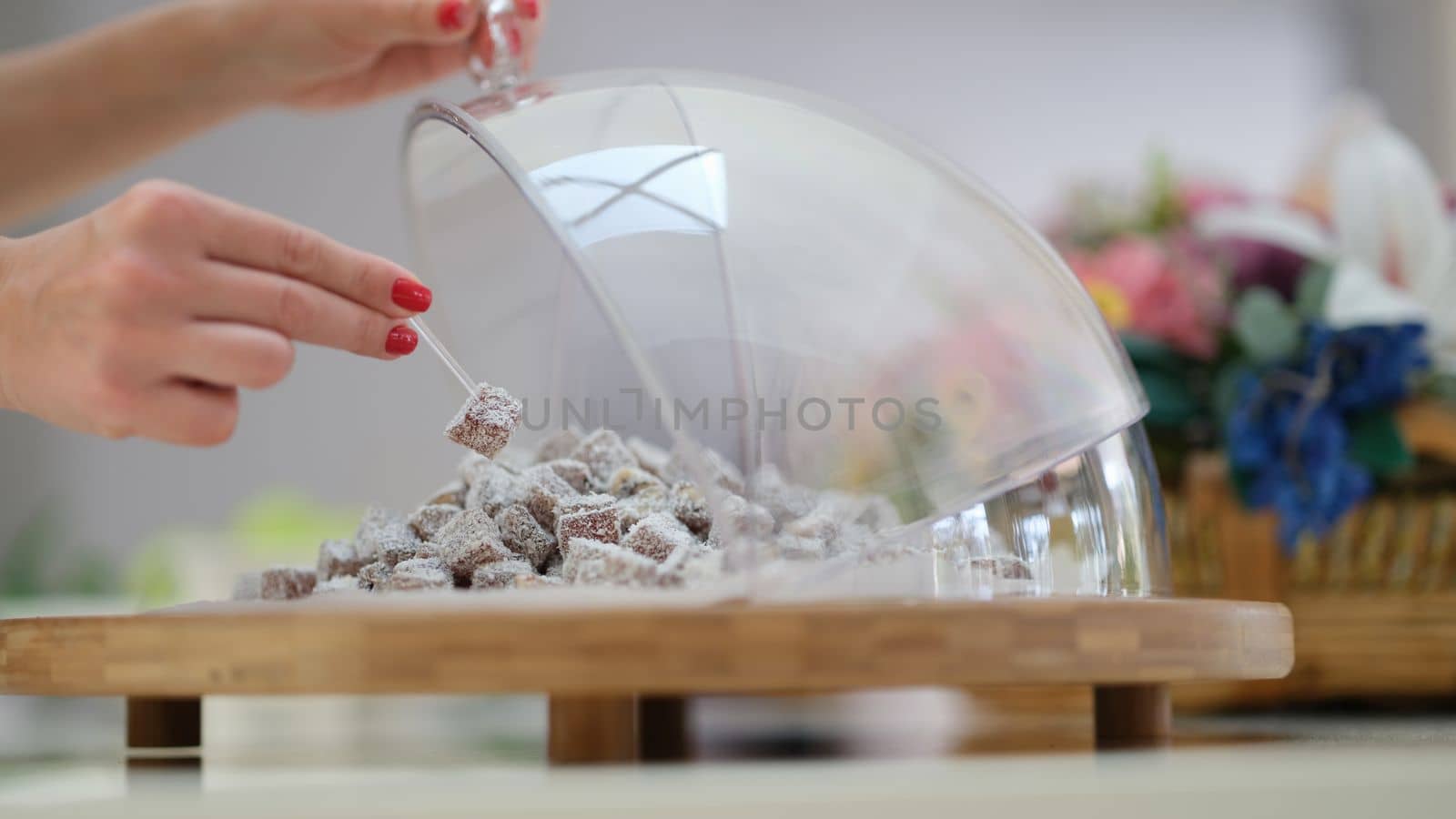 Hand selection of Turkish delight with coconut and pistachios on table. by kuprevich