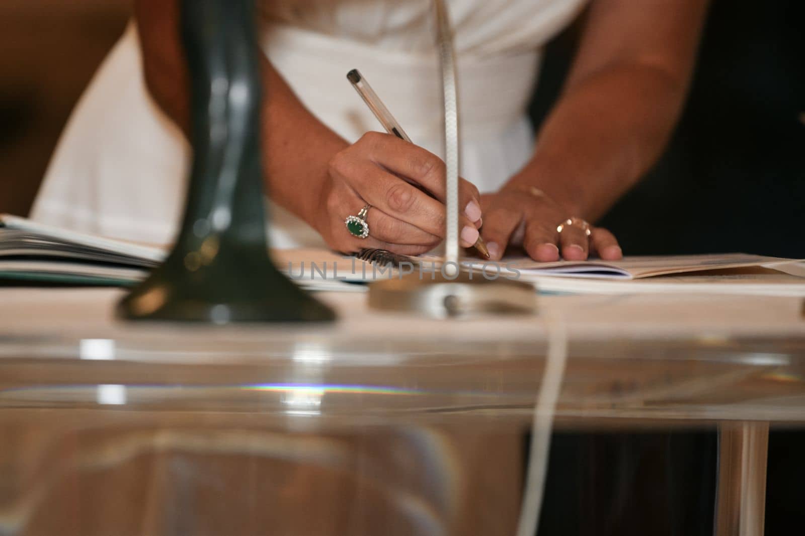 A bride signs the marriage registration documents