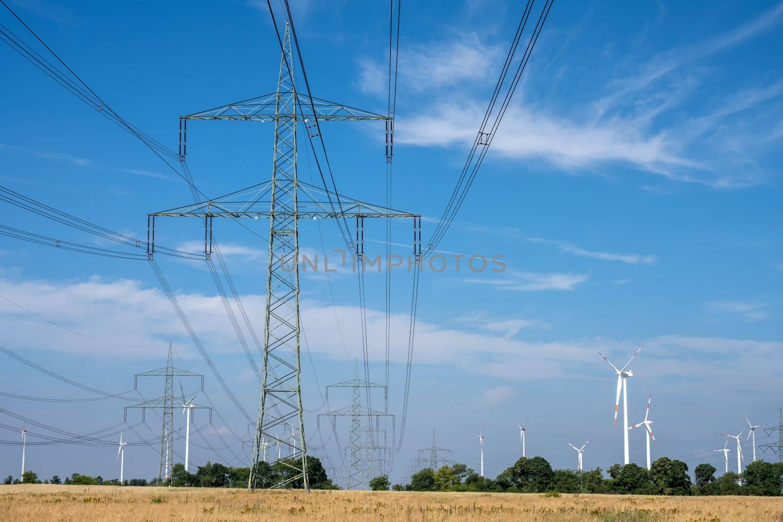 Electricity pylons, power lines and wind turbines by elxeneize