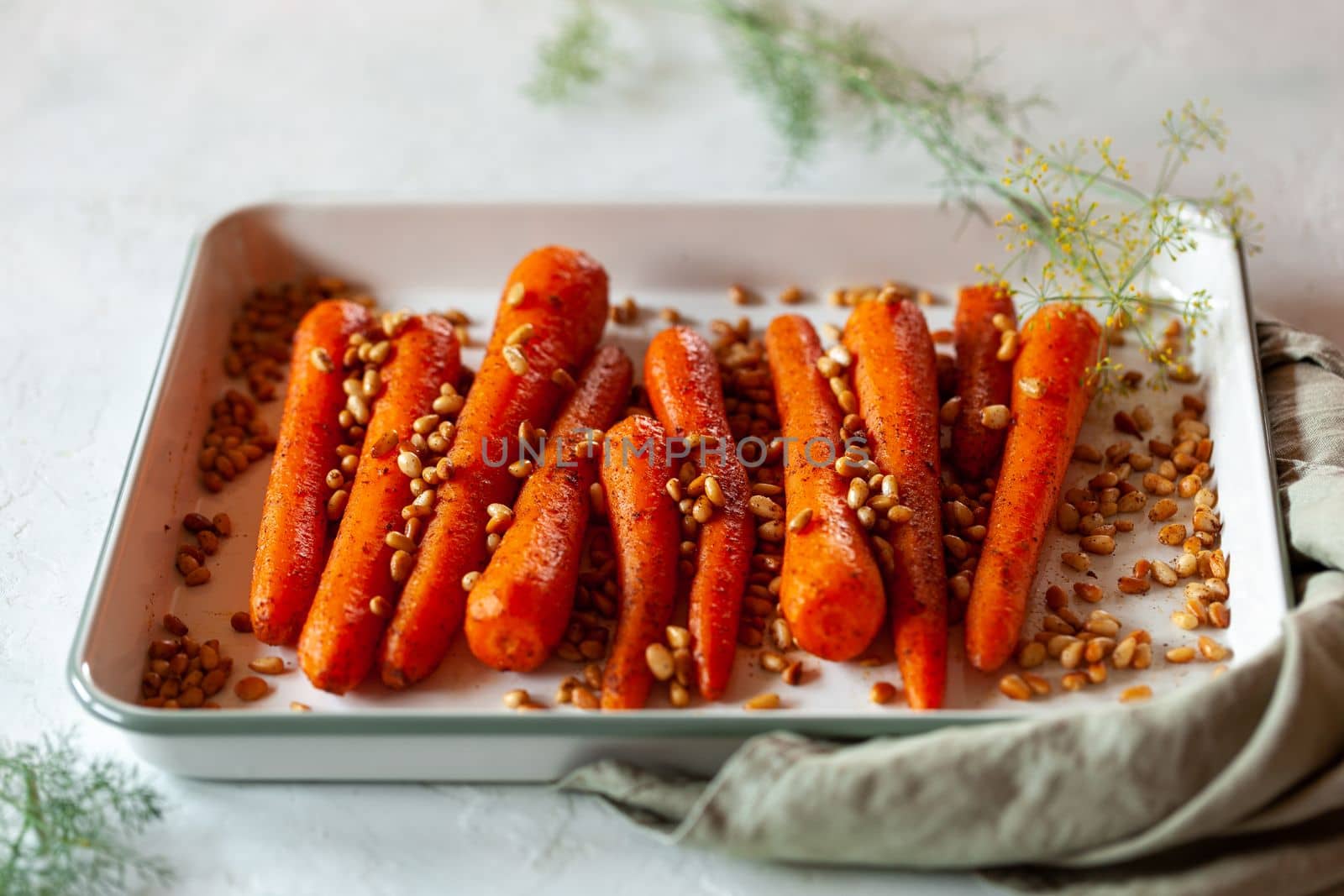Lebanese-style carrots prepared with pine nuts and cumin, side view