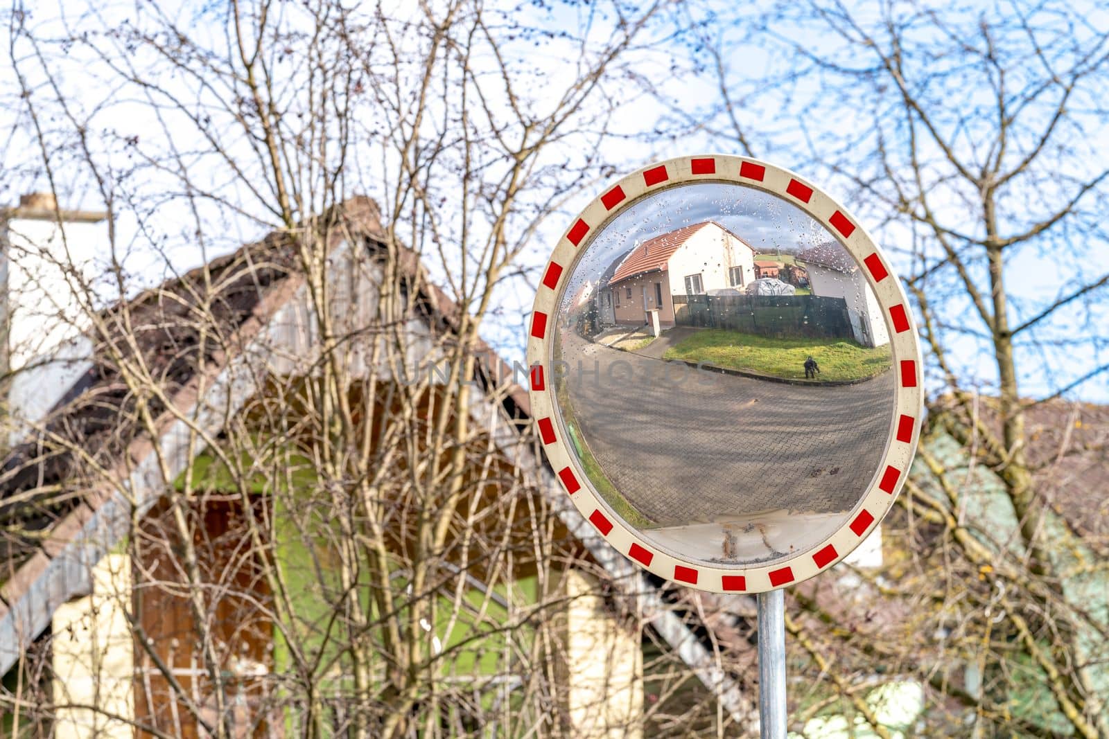 mirror at the side of the road for an overview on the road. High quality photo