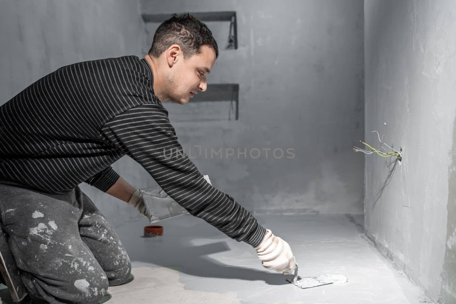 waterproofing of the bathroom floor in a new building.