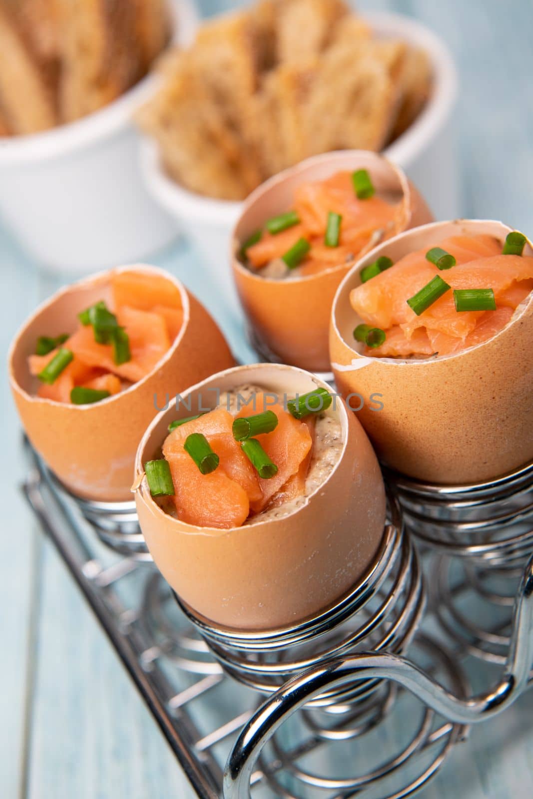 Recipe eggs casserole cooked in the shell with mushroom cream sauce and smoked salmon, High quality photo