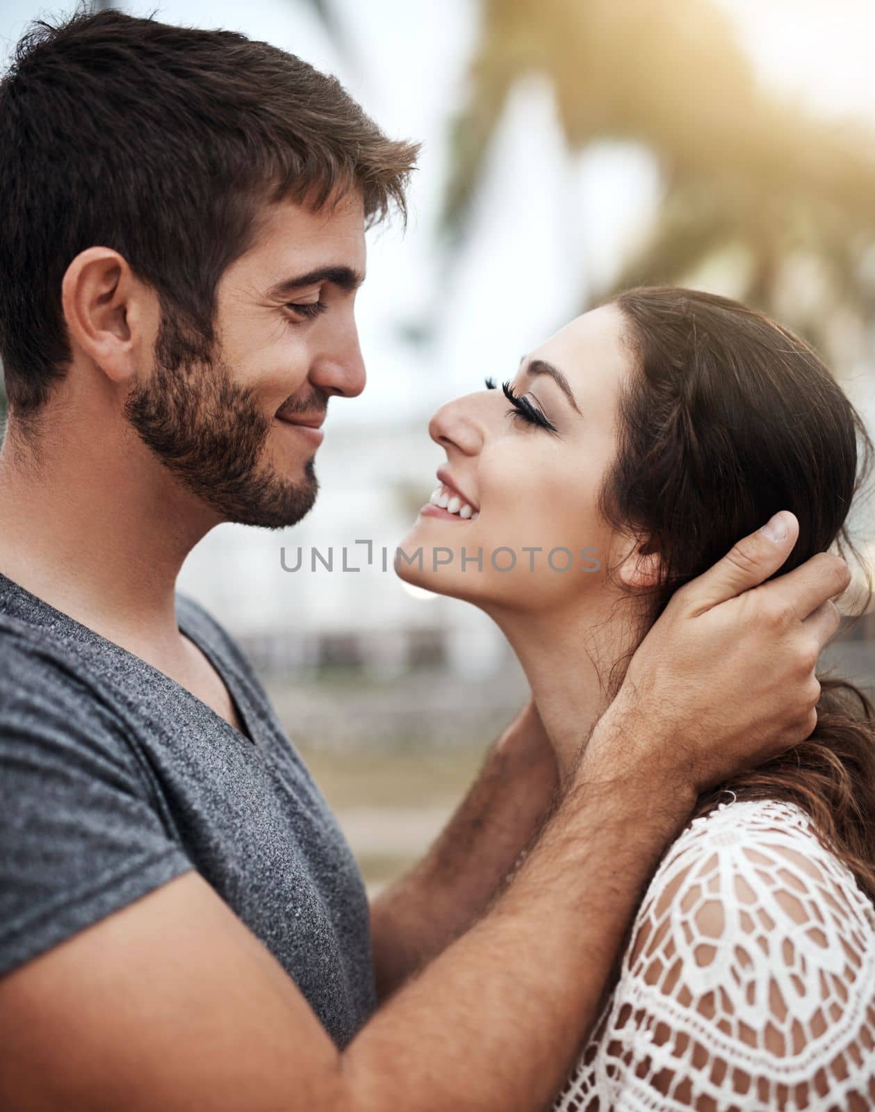 Im in love with every part of you. a young couple spending a romantic day at the beach. by YuriArcurs