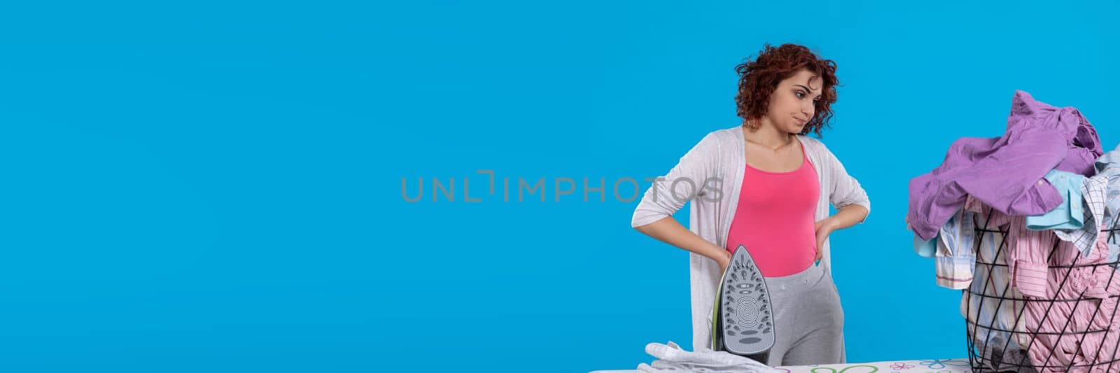 A lot of work to do awaits the woman, who wonders where to start. A resigned look on the girl's face. Panoramic frame of young girl.