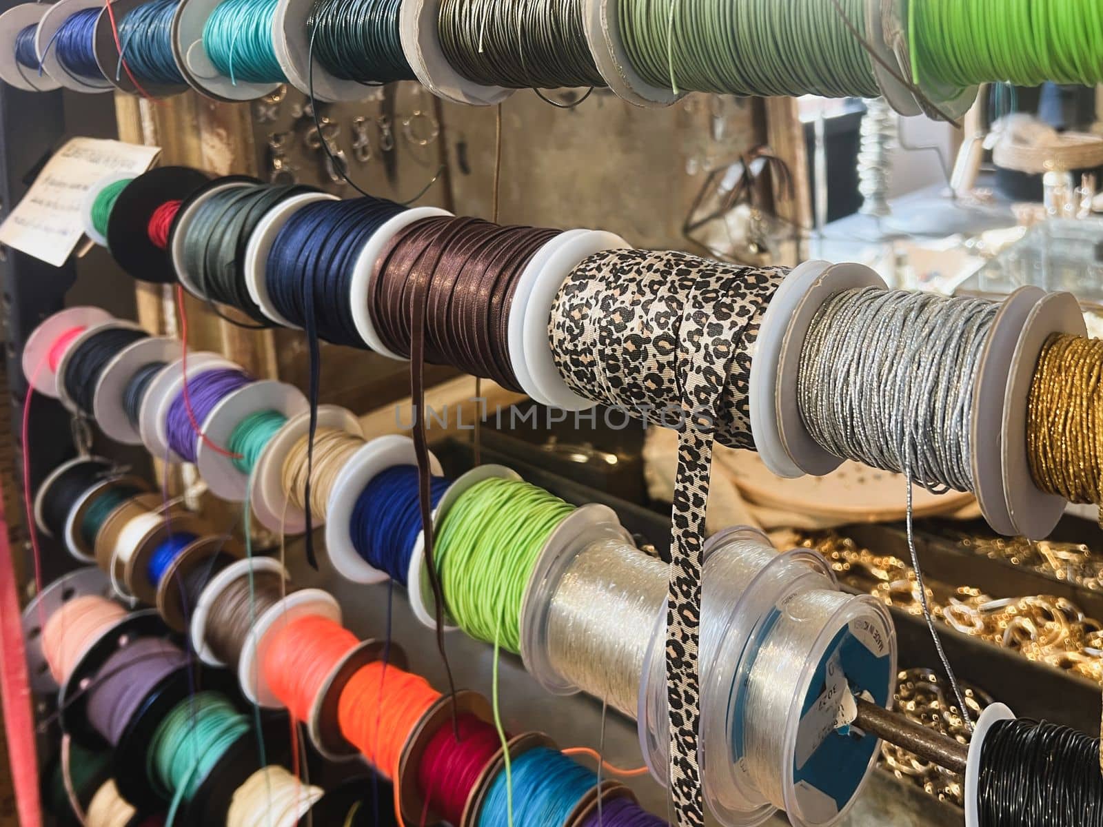 Reels of ribbons hanging in a store