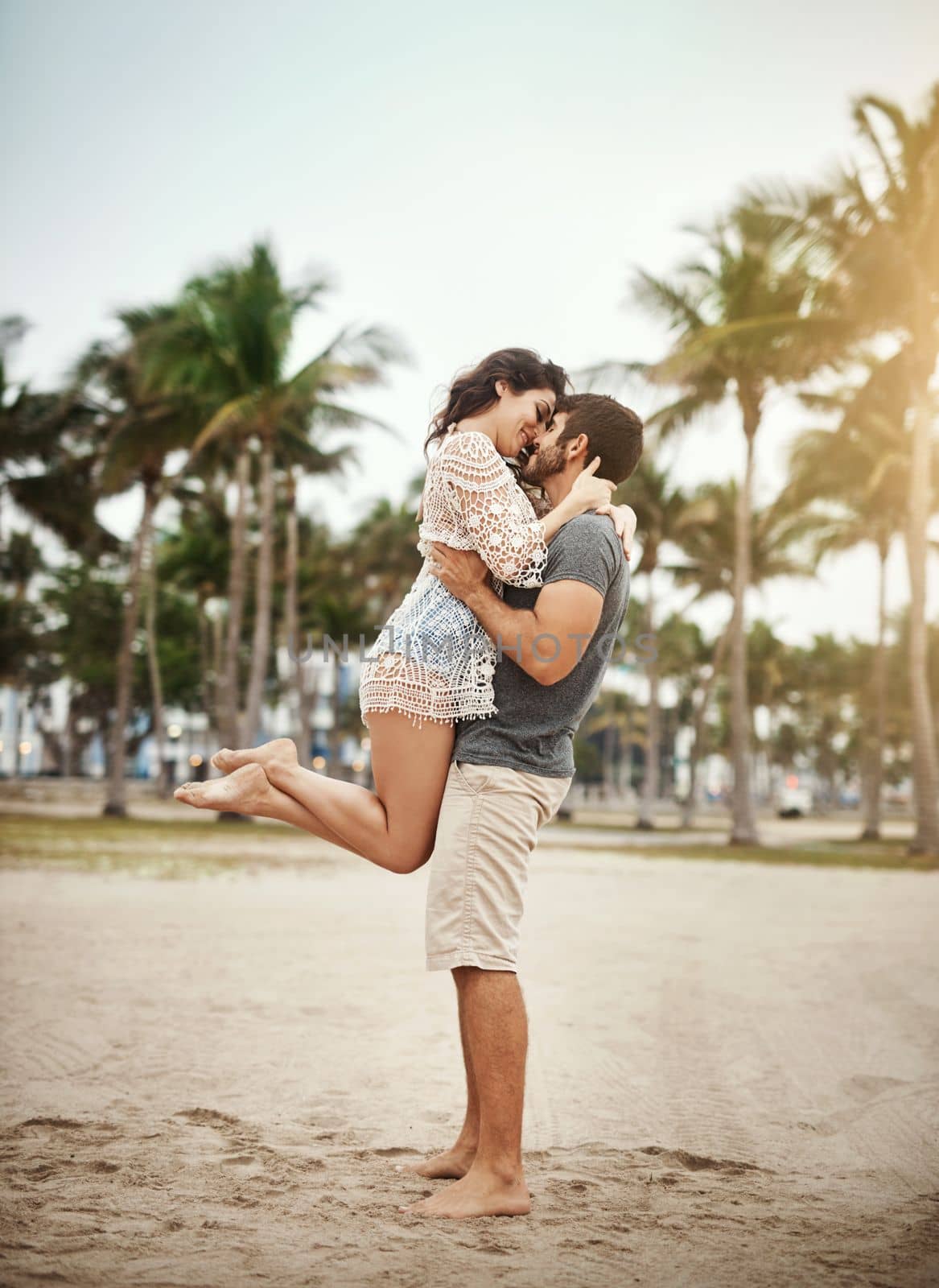 Love, lifes greatest pleasure. a young couple spending a romantic day at the beach. by YuriArcurs