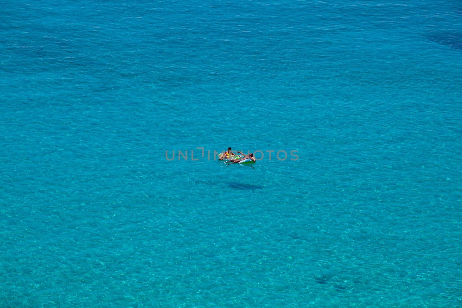 LAMPEDUSA, ITALY - AUGUST, 03: View of the most famous sea place of Lampedusa, It is named Spiaggia dei conigli, in English language Rabbits Beach or Conigli island on August 03, 2018