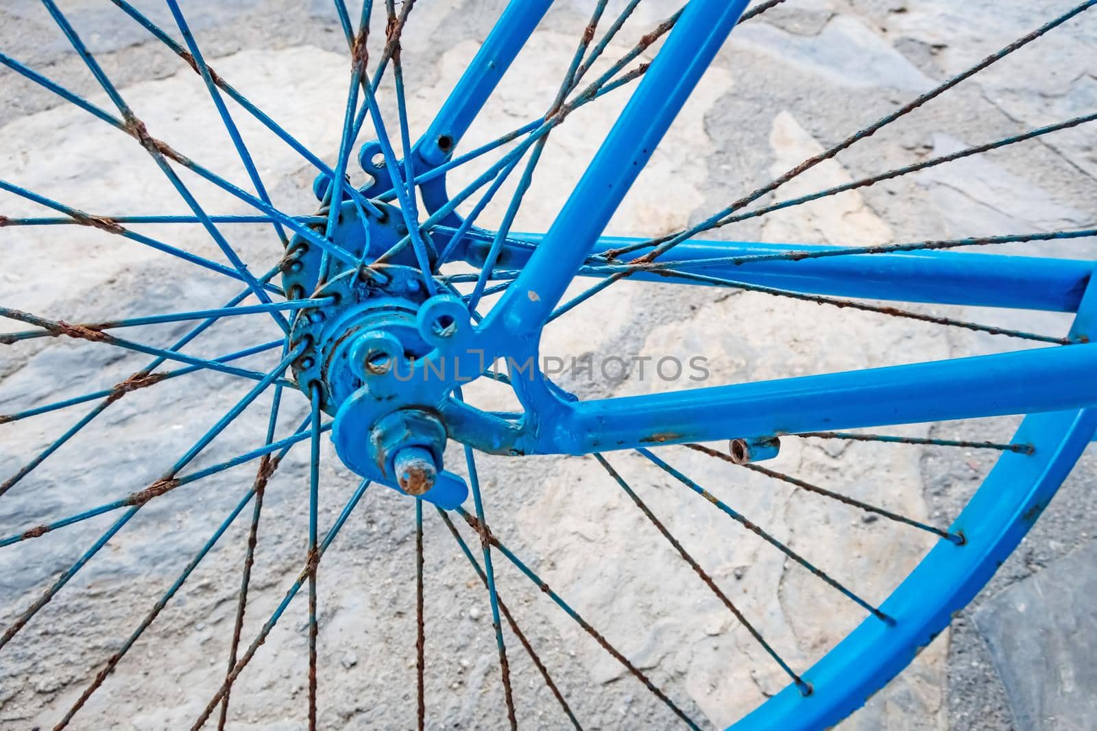 blue colored decorative old bicycle in the garden by yilmazsavaskandag