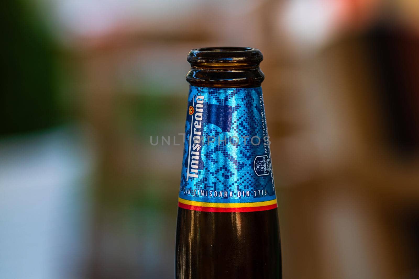 Romanian Timisoreana beer isolated, close up on detail of glass beer bottle. Bucharest, Romania, 2020