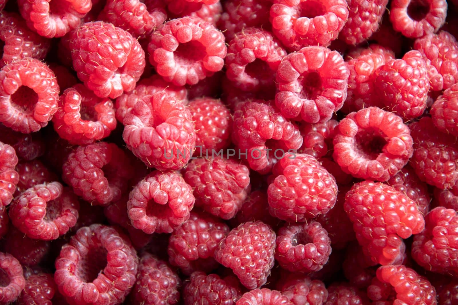 natural fruit background of fresh raspberries top view, texture of berries by KaterinaDalemans