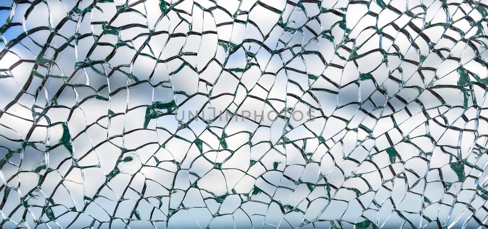 Useful texture overlay. A broken glass on. with many sharp shards. Useful texture overlay for background.