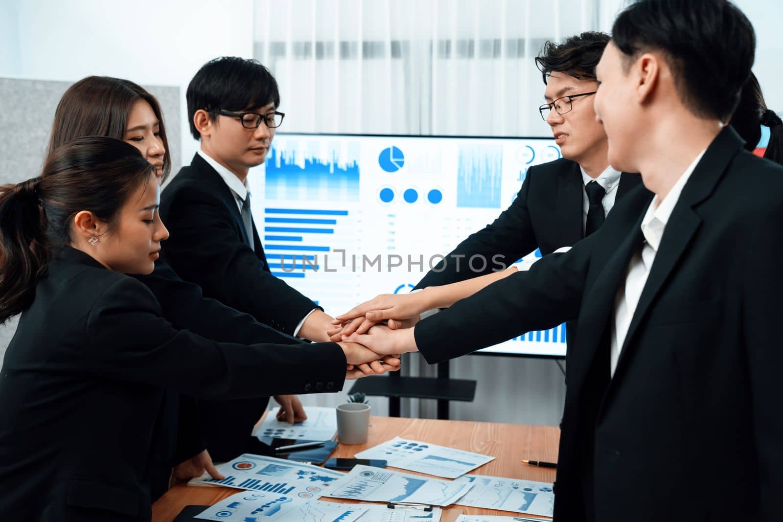 Closeup business team join hand stack together for harmony concept. by biancoblue