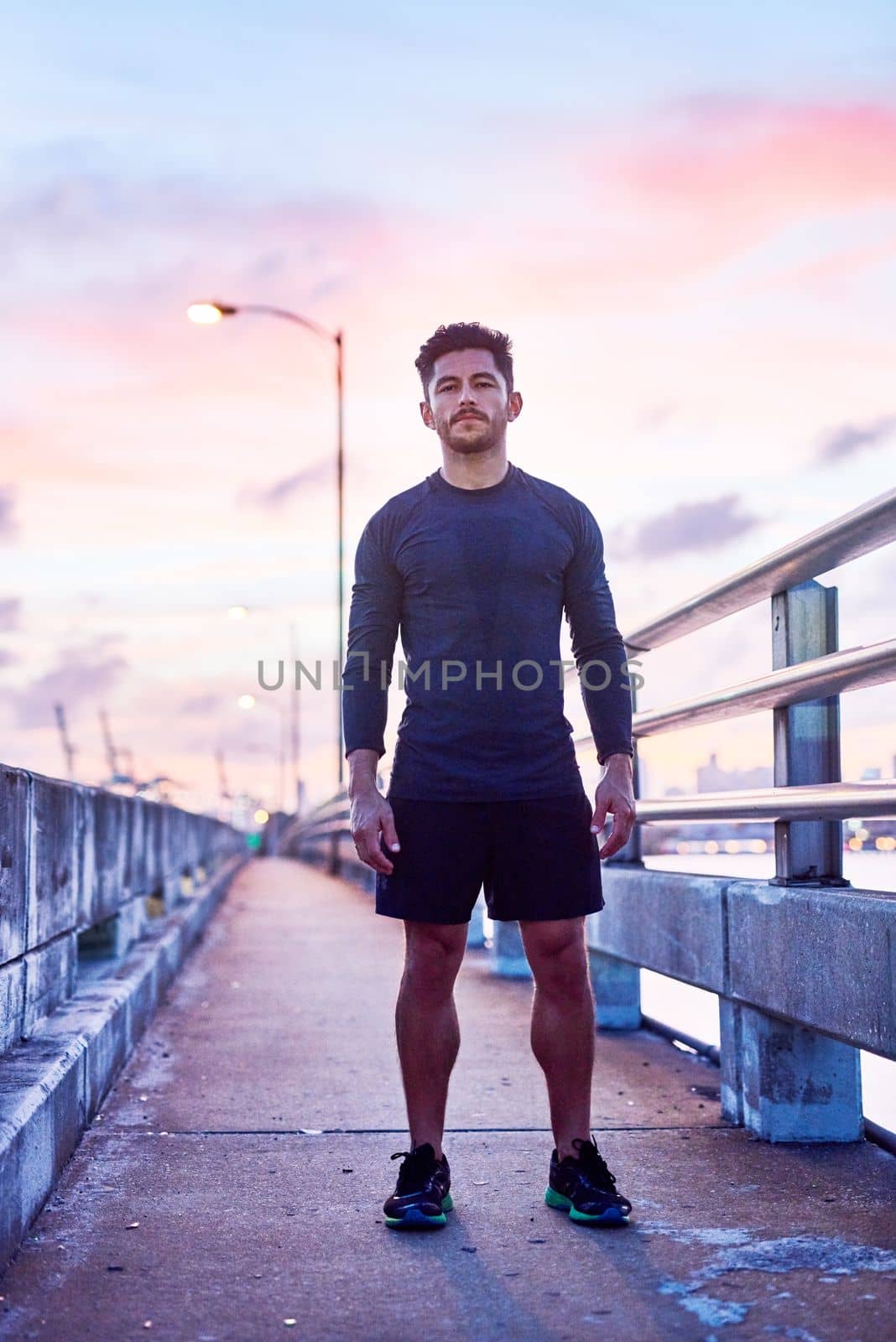 Focus on moving forward. Portrait of a handsome young man exercising outdoors