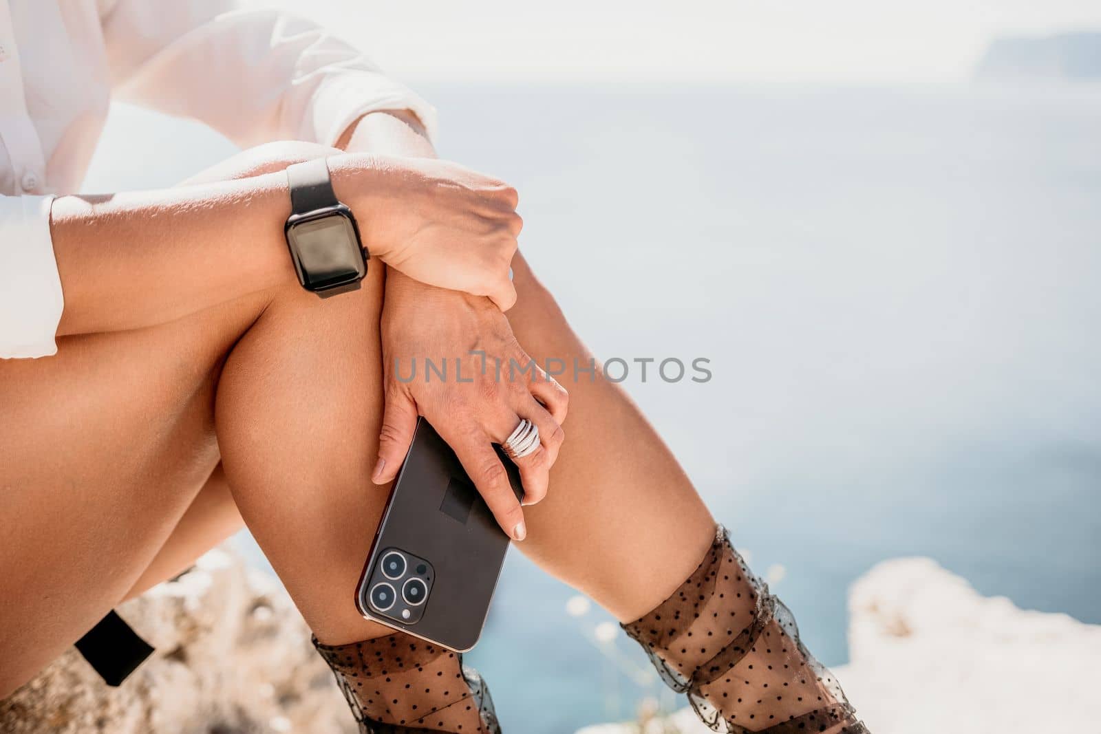 Woman sea laptop. Business woman in yellow hat freelancer with laptop working over blue sea beach. Girl relieves stress from work. Freelance, digital nomad, travel and holidays concept by panophotograph