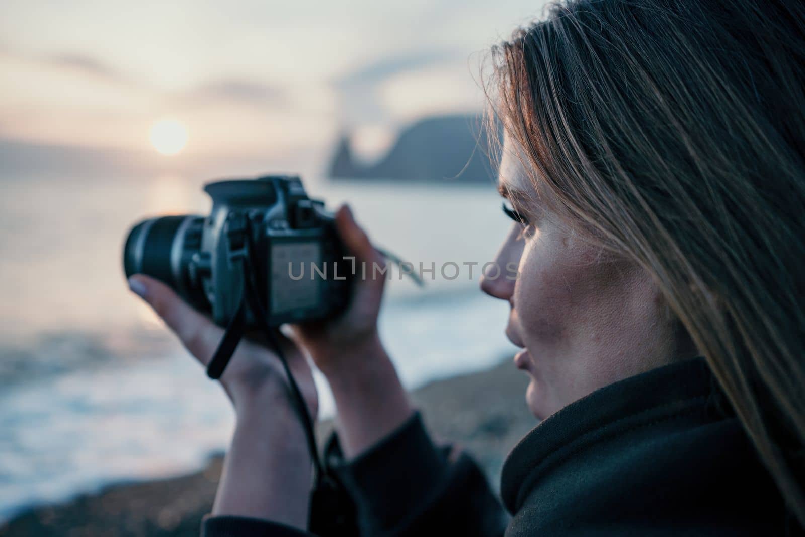 Woman travel sea. Happy tourist enjoy taking picture outdoors for memories. Woman traveler looks at sea bay of mountains, sharing travel adventure journey by panophotograph