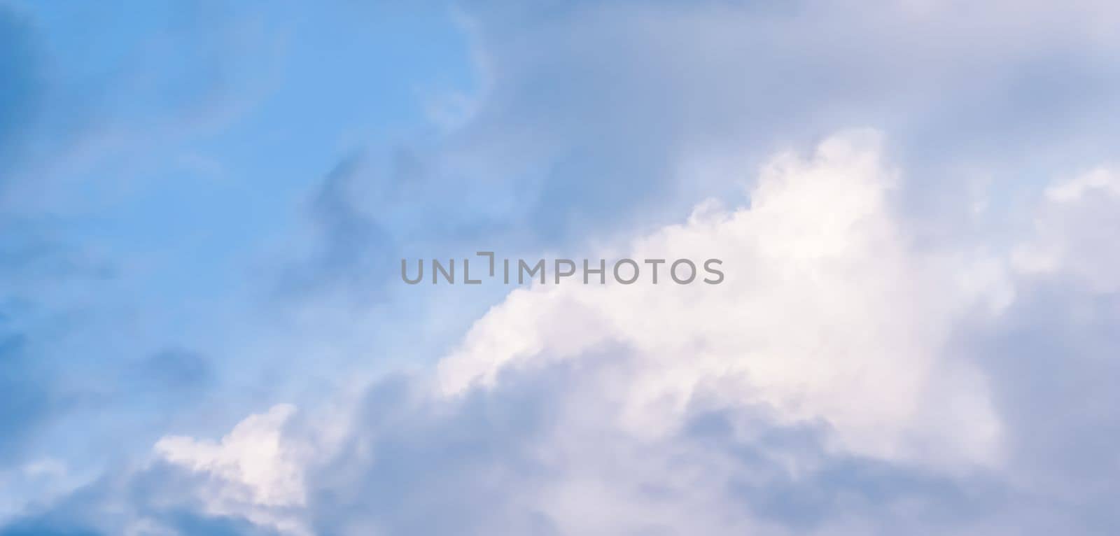 Background of blue sky with white clouds. Natural backdrop