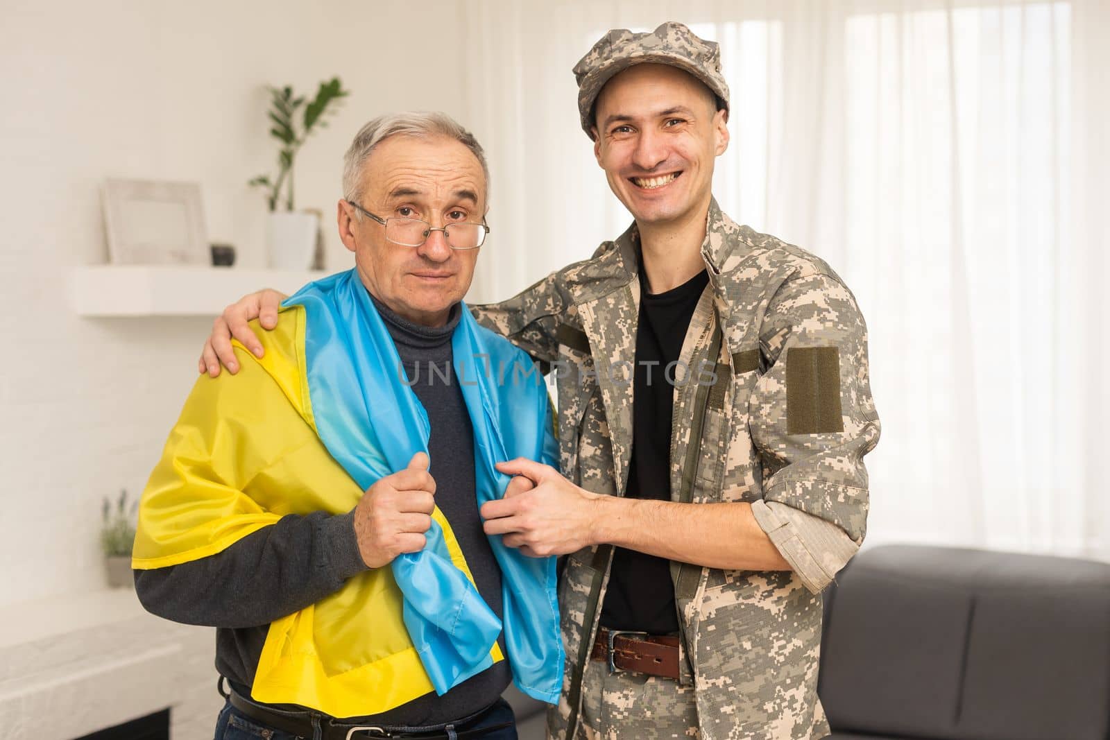 elderly father and son military flag of Ukraine.