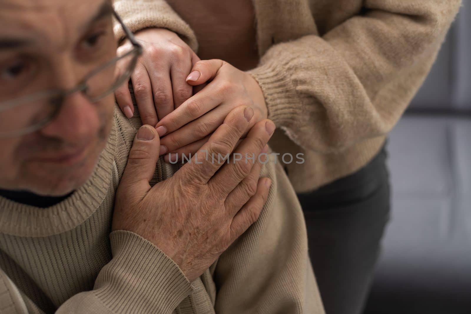 Hands of the old man and a young woman. close up