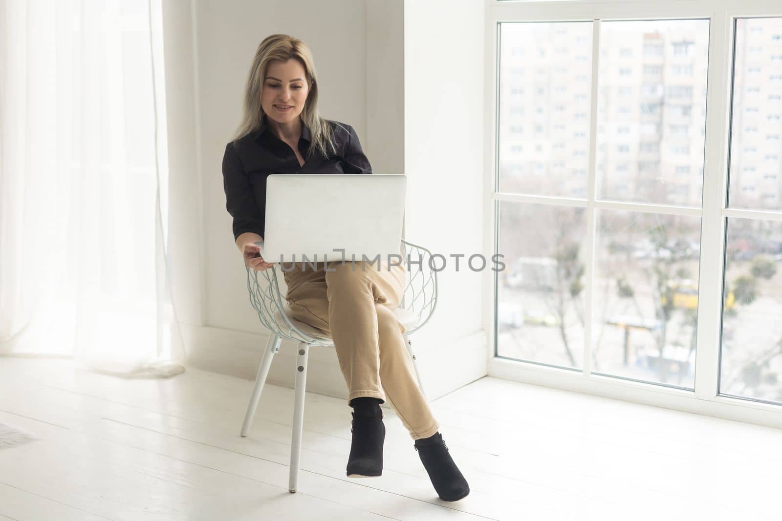 Shot of an attractive mature businesswoman working on laptop in her workstation