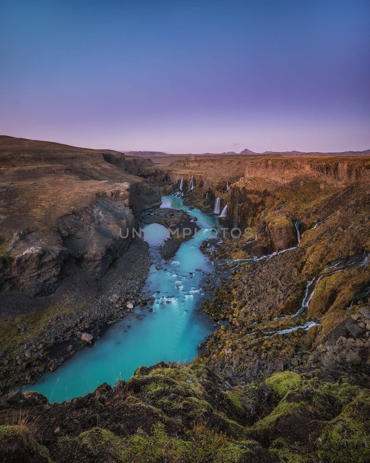 Icelands mountainous landscape combined with northern latitude, which has lots of rain, snow, and glaciers, is why the country has so many waterfalls and cascading water slopes.