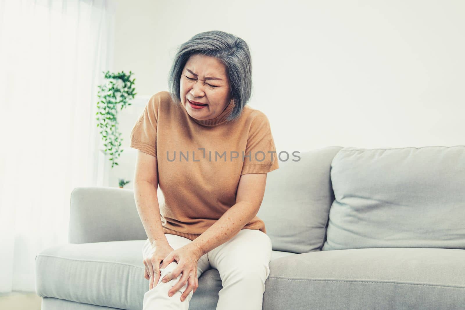 An agonizing elderly woman is experiencing chest pain. by biancoblue