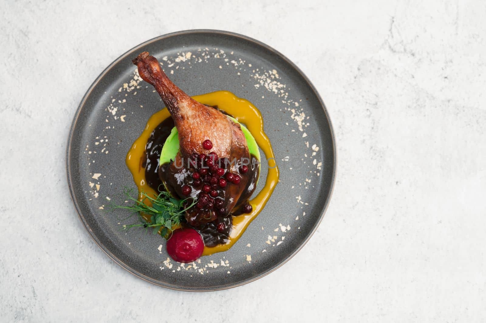 Tasty duck breast with orange and berries