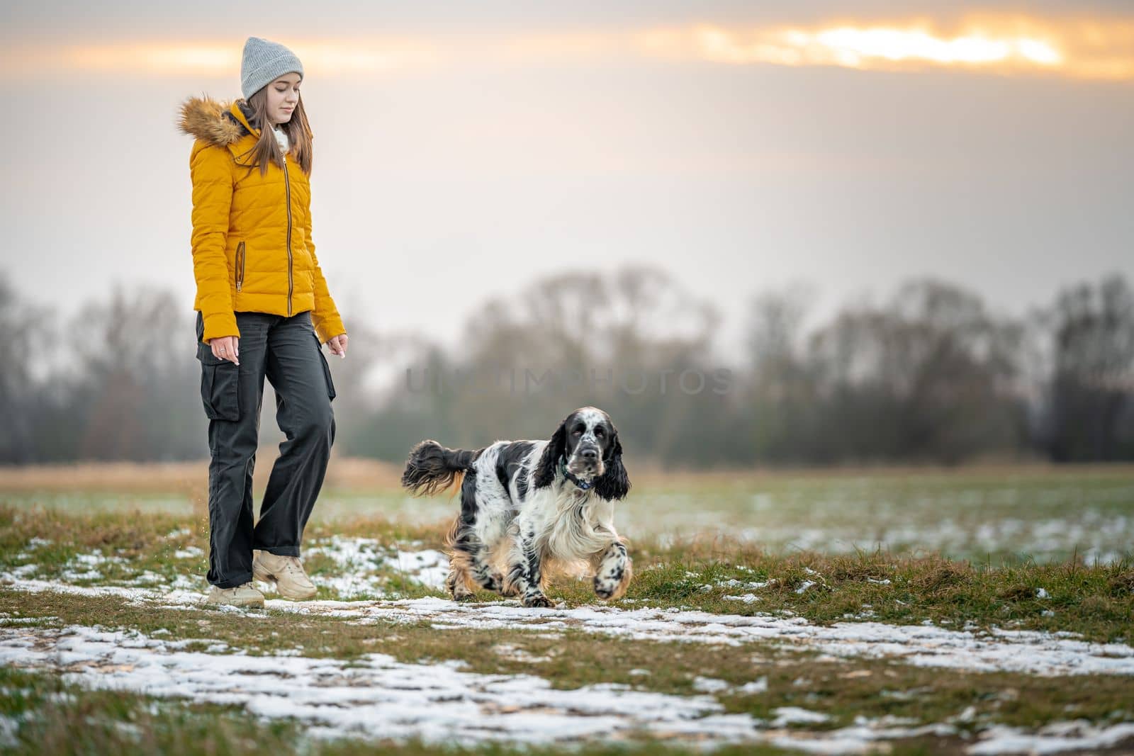 teenager with a dog on a walk in the park. High quality photo