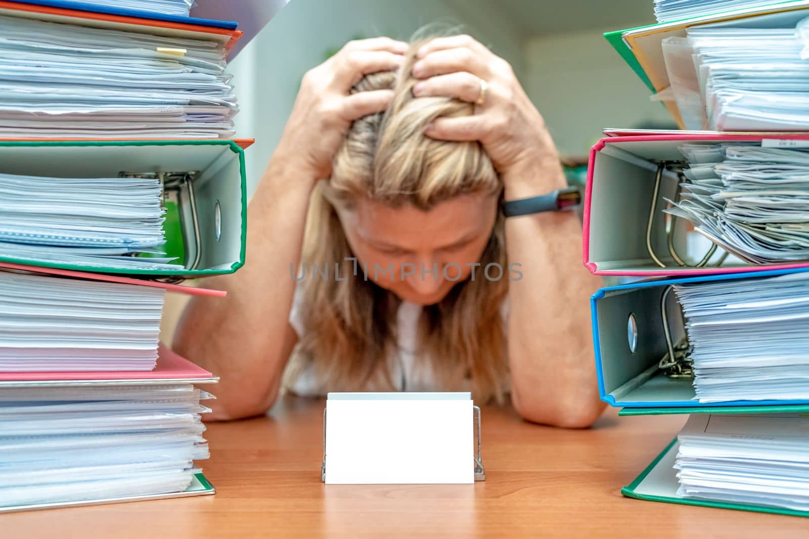 accountant in stress among colorful folders, mockup. High quality photo