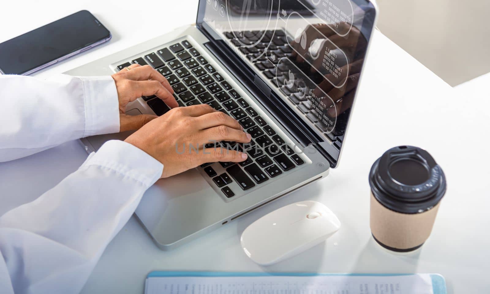 Nurse working using computer browsing internet by Sorapop