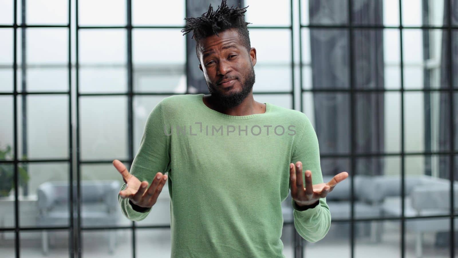 Portrait of a happy African American entrepreneur in office