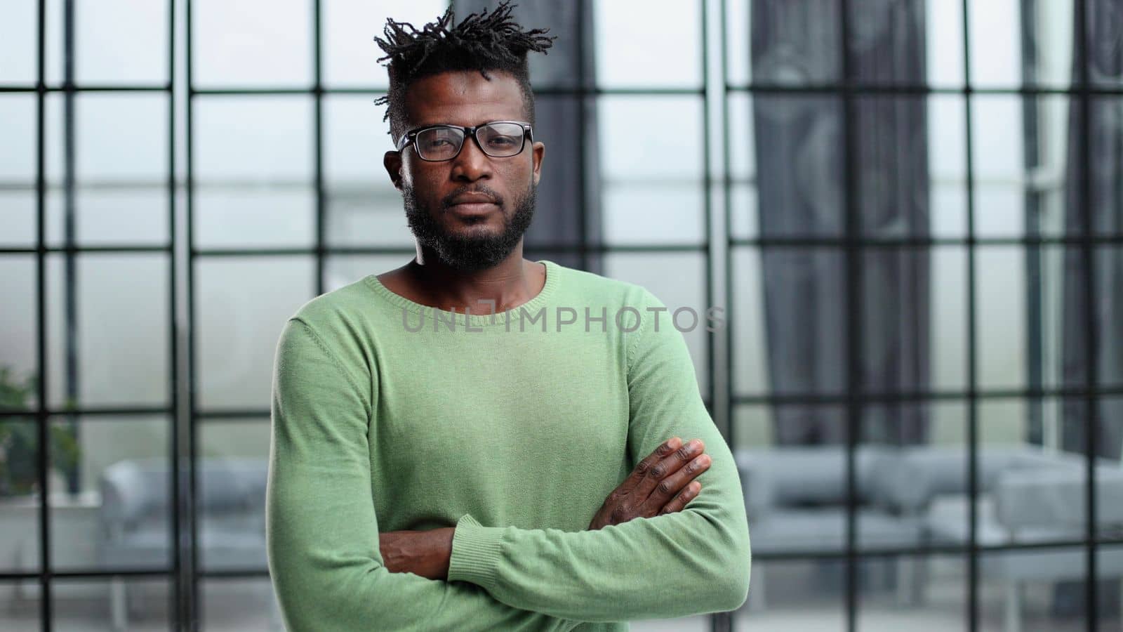Mature cheerful african american executive businessman at workspace.