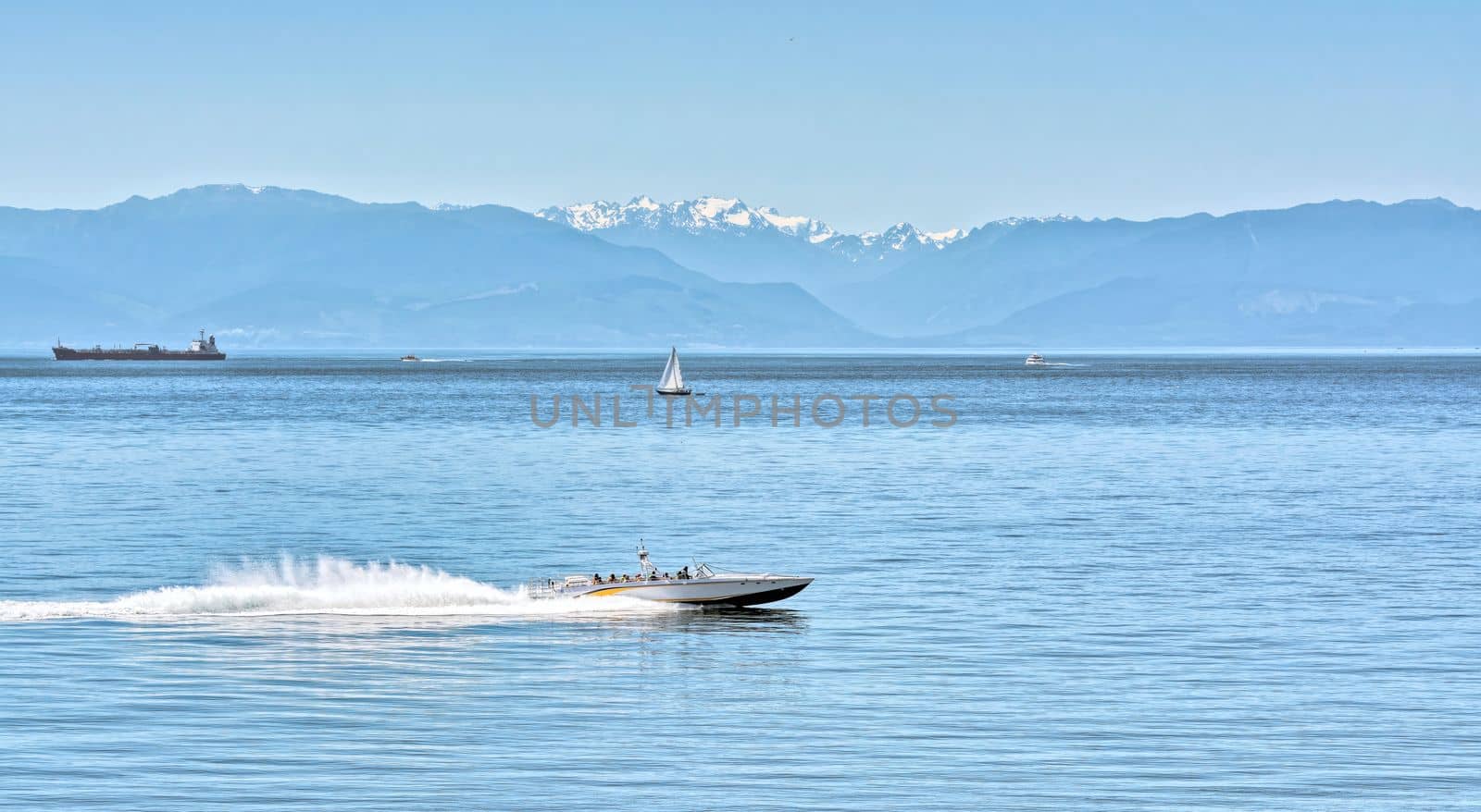 Power motor boat running over the bay with tourist tour by Imagenet