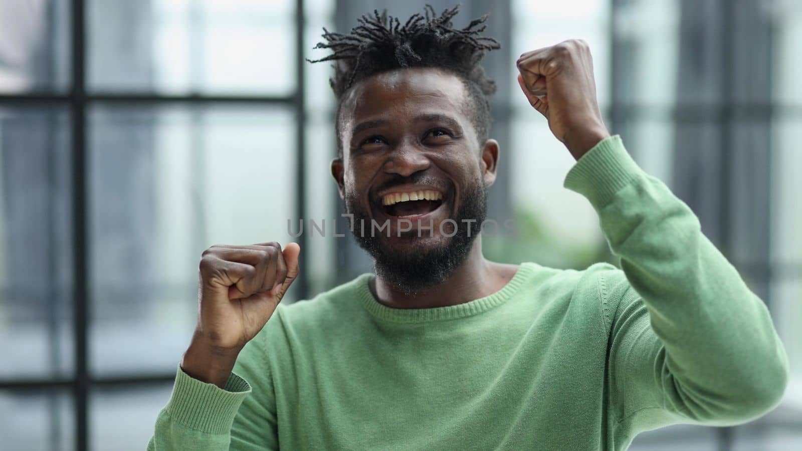 Happy Excited Young Man With Arms Up