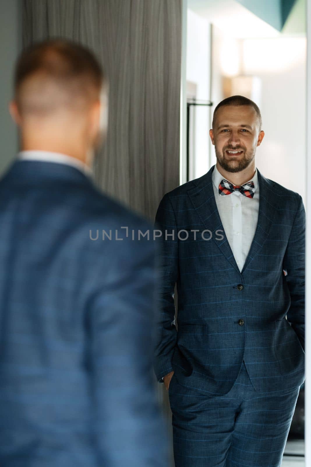 portrait of smiling groom with beard by Andreua