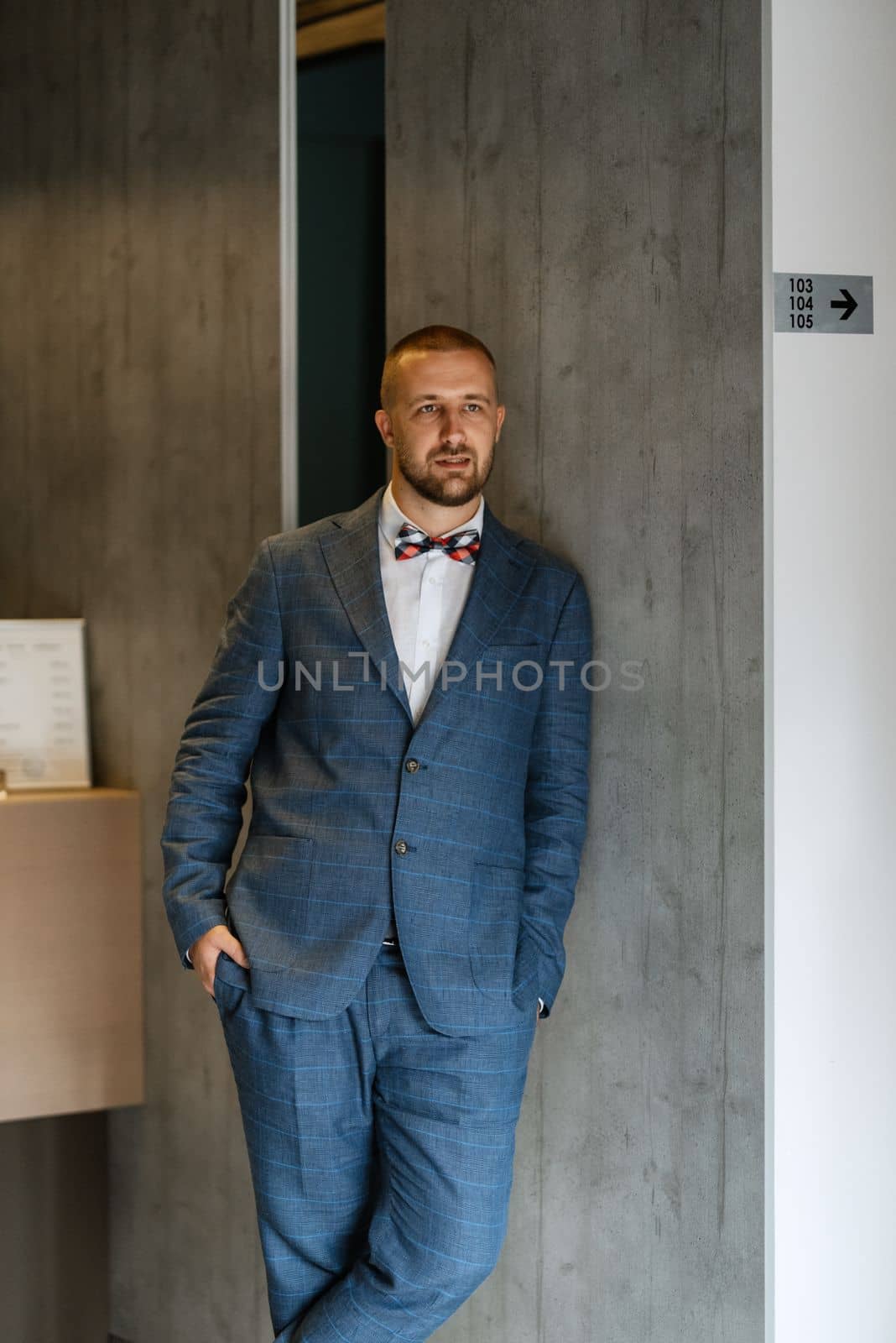 portrait of smiling groom with beard by Andreua