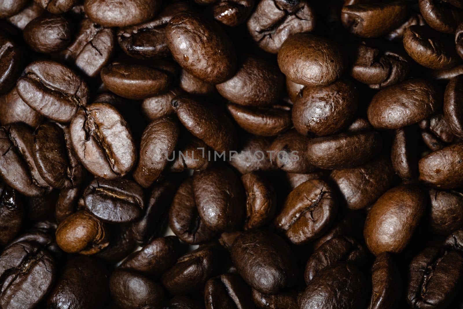 Roasted coffee beans background. Freshly roasted coffee beans background