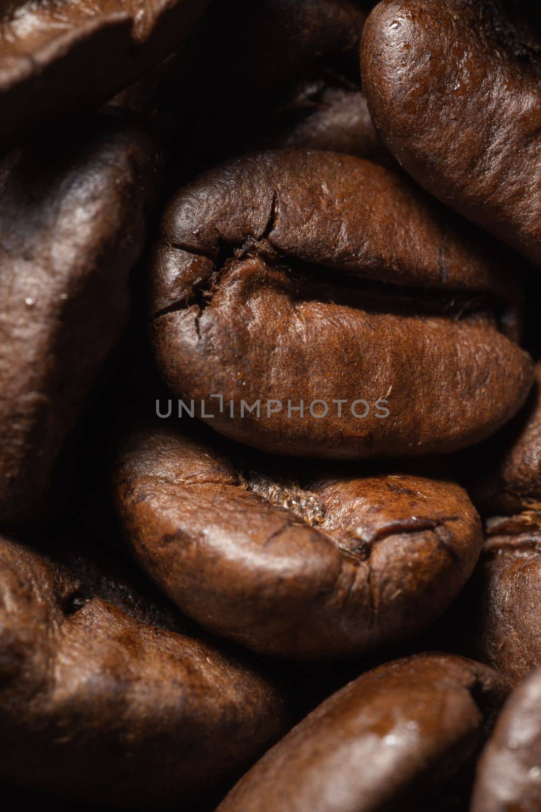 Roasted coffee beans background. Freshly roasted coffee beans background