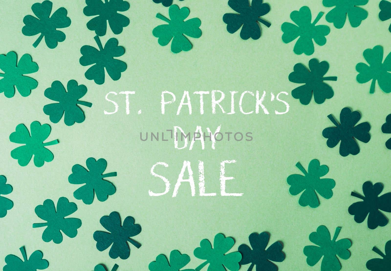 green background with st. patrick's day sale text. High quality photo