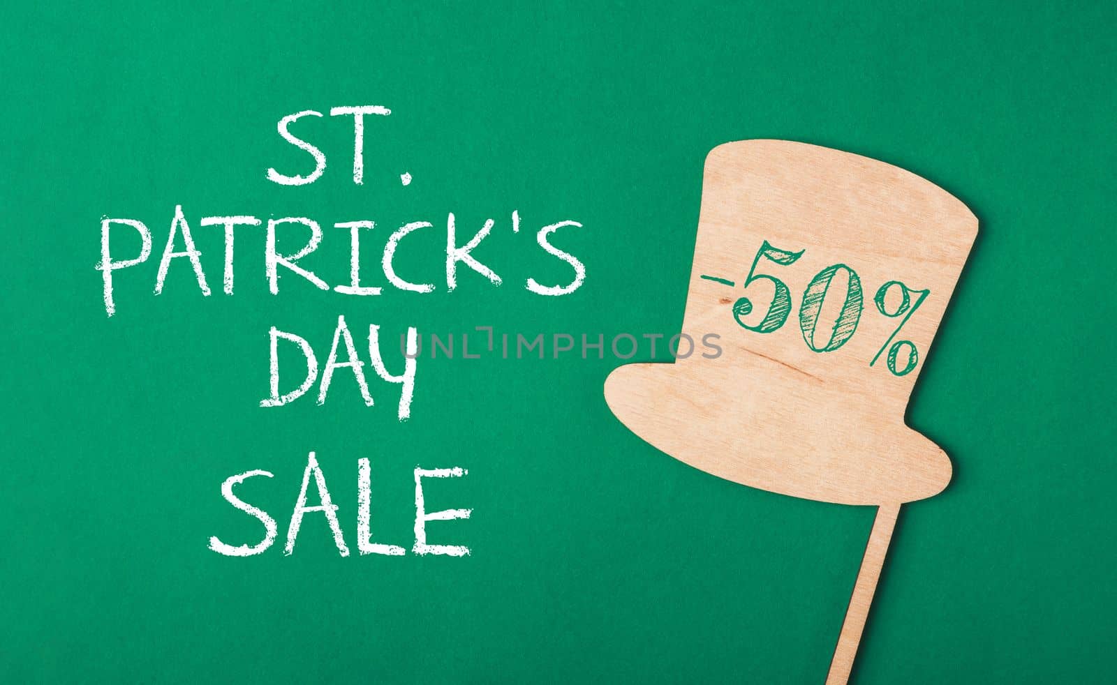 St. Patrick's Day Sale - 50 off. Banner on green background with hat and quatrefoil
