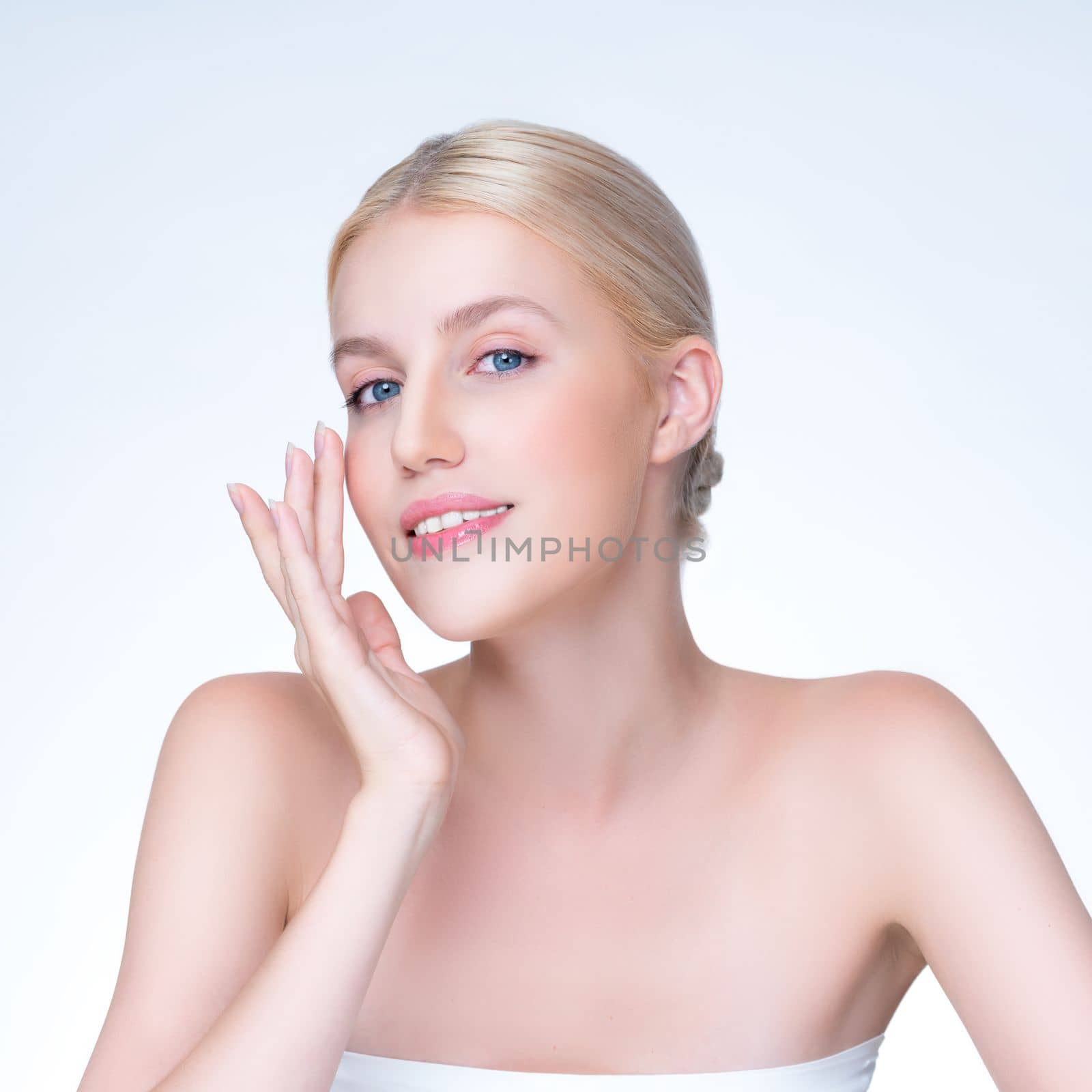 Personable beautiful woman portrait with perfect smooth clean skin and natural makeup portrait in isolated background. Hand gesture with expressive facial expression for beauty model concept.