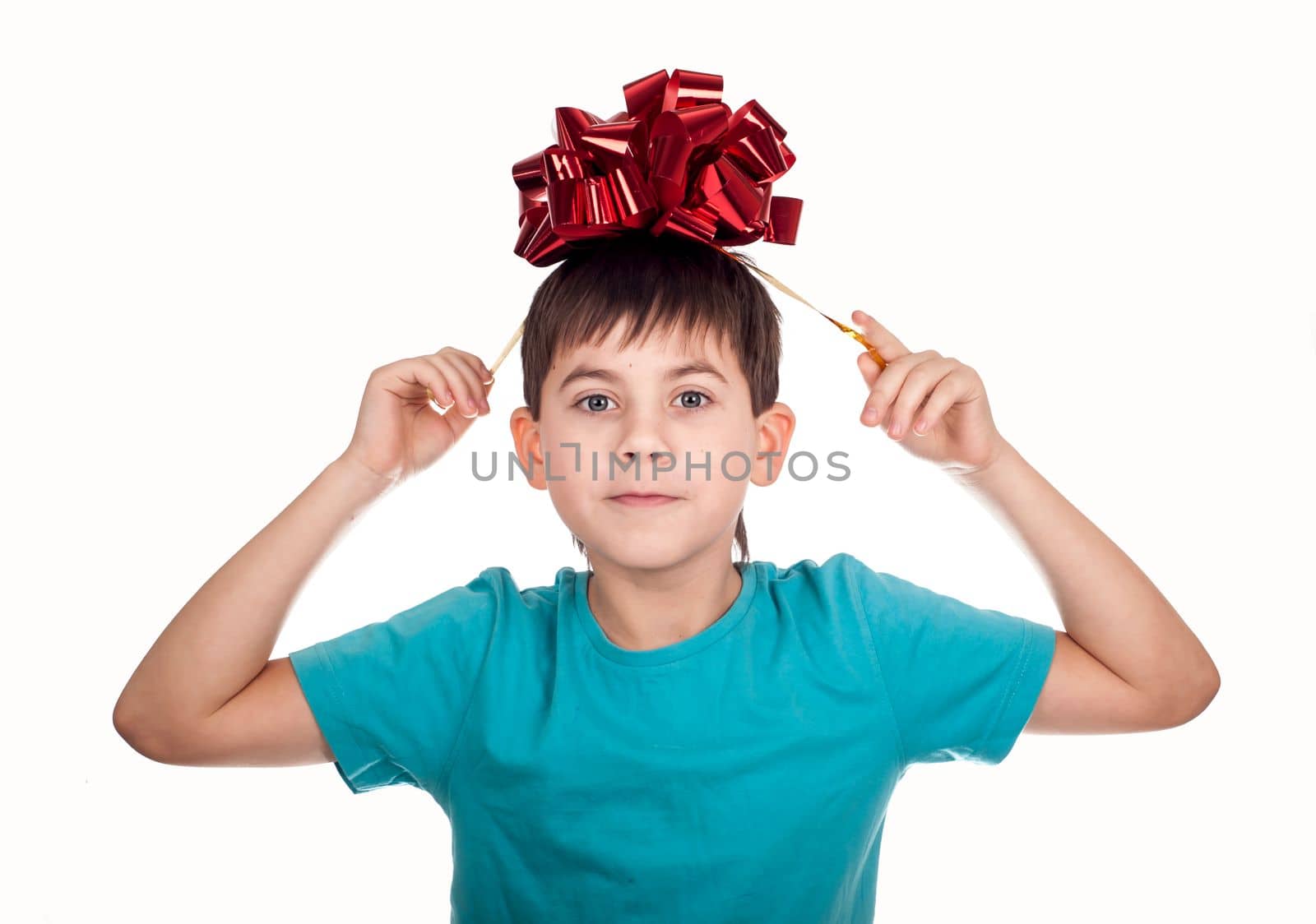 child gift. little boy with a red bow in hand isolated on white background by aprilphoto