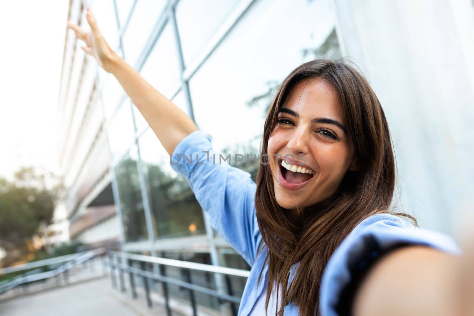 Young caucasian brunette woman taking selfie looking at camera. Copy space. Having fun concept.