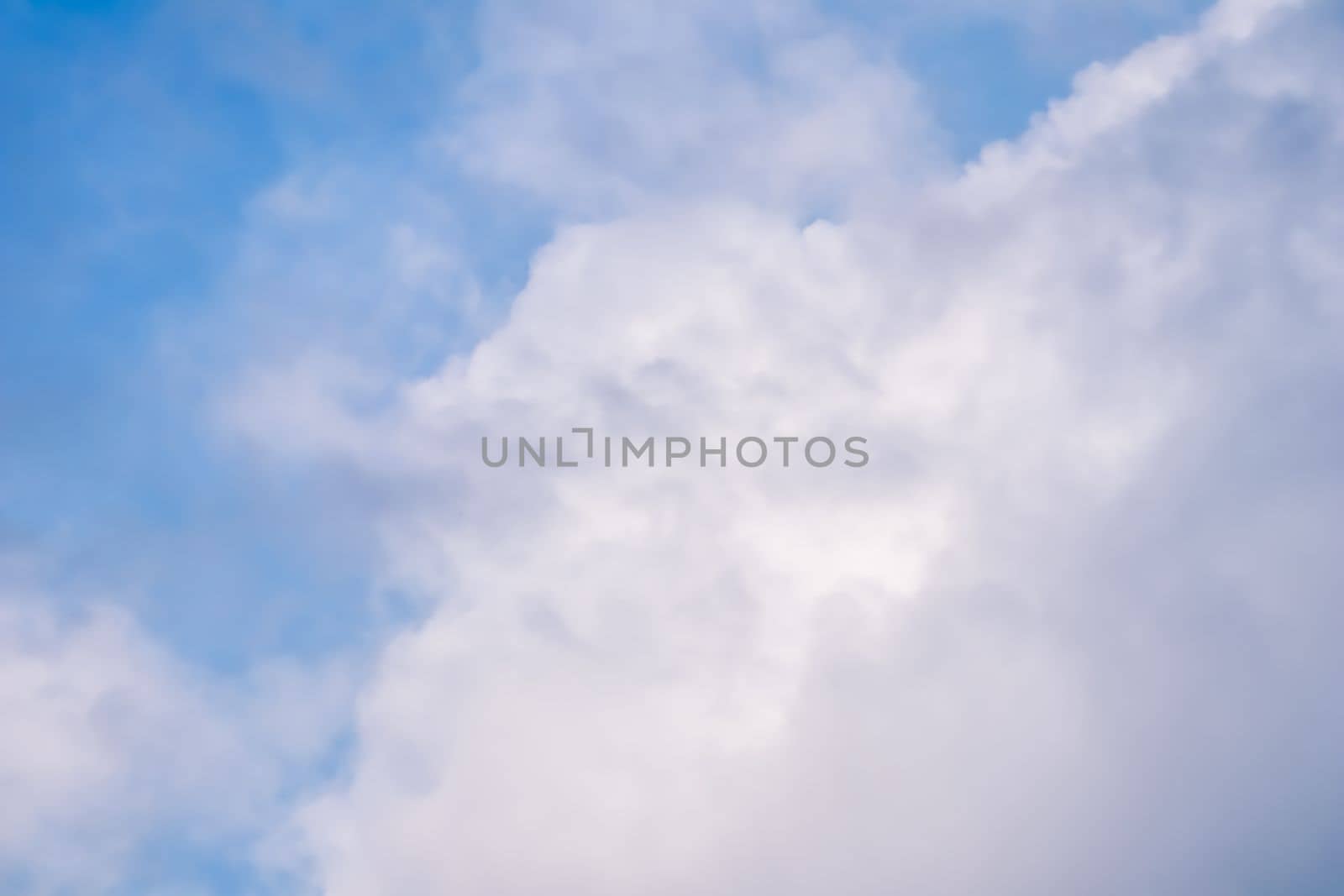 Background of blue sky with white clouds. Natural backdrop