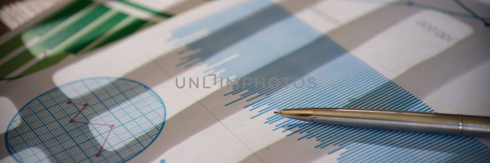 Financial report and strategic plan charts with pointers closeup. Pen documentation company strategy. Educational information or data for workers