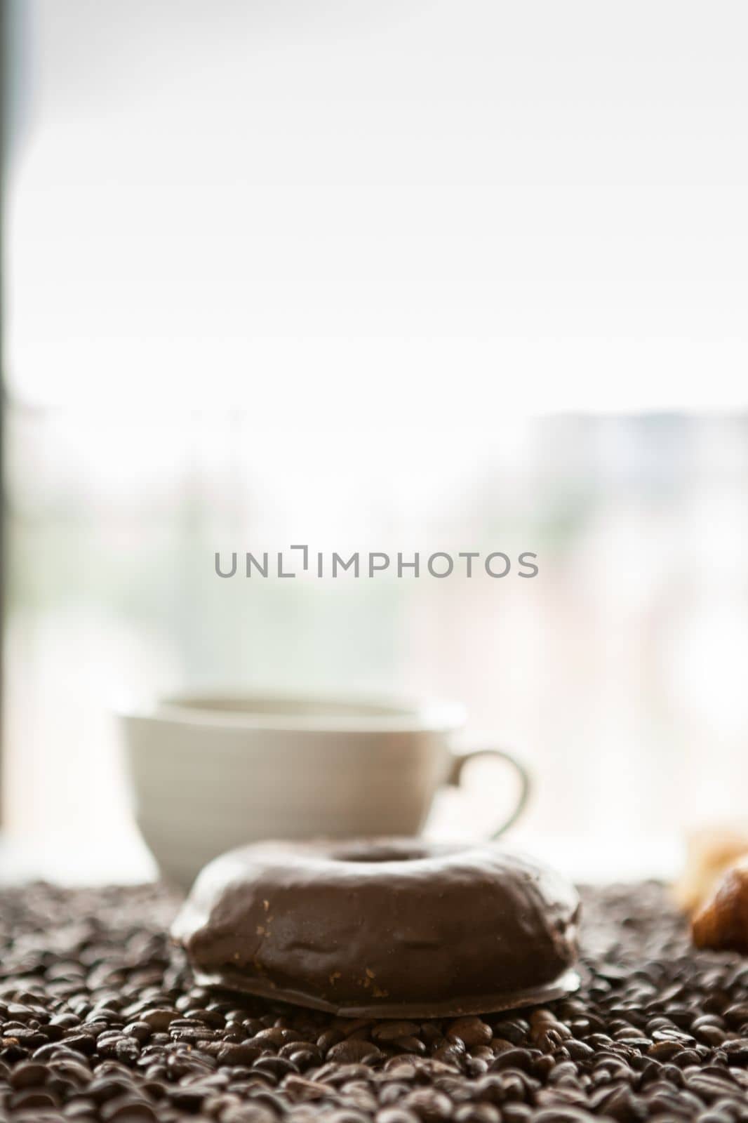 Coffee cup, donut and coffee beans by DCStudio
