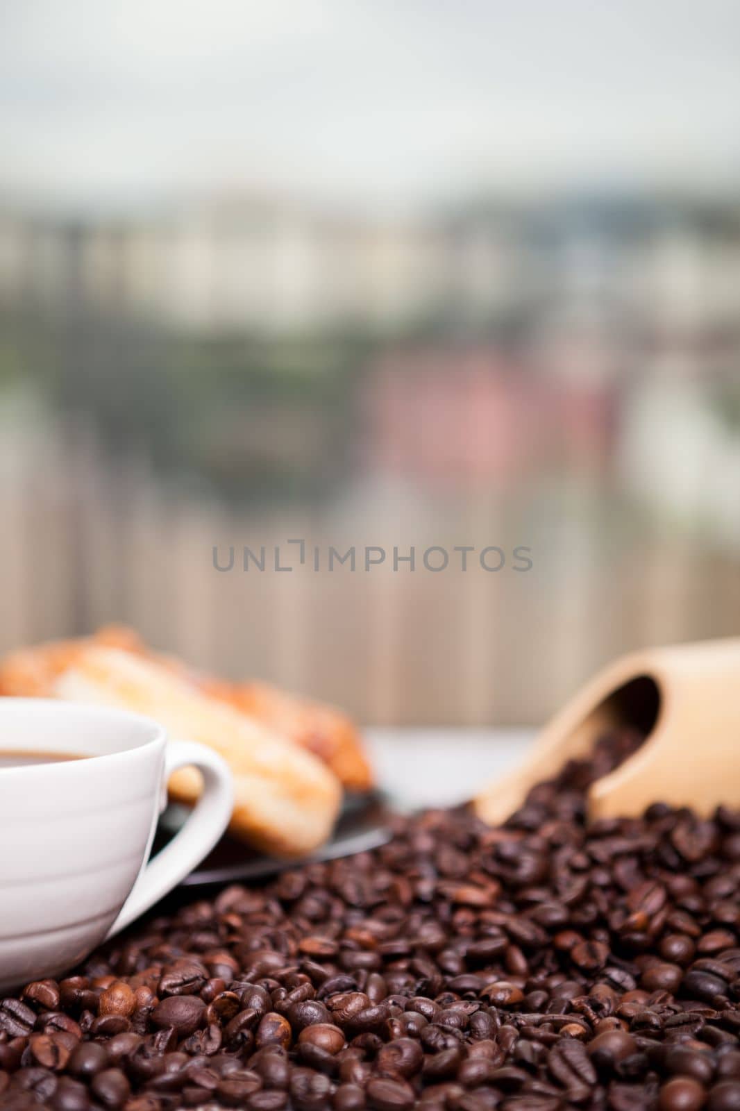 Coffee beans, donut and a cup of coffee by DCStudio